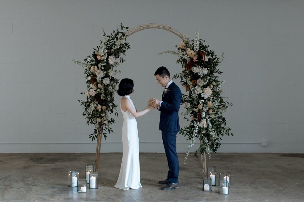 A couple sharing their vows at Factory Atlanta.