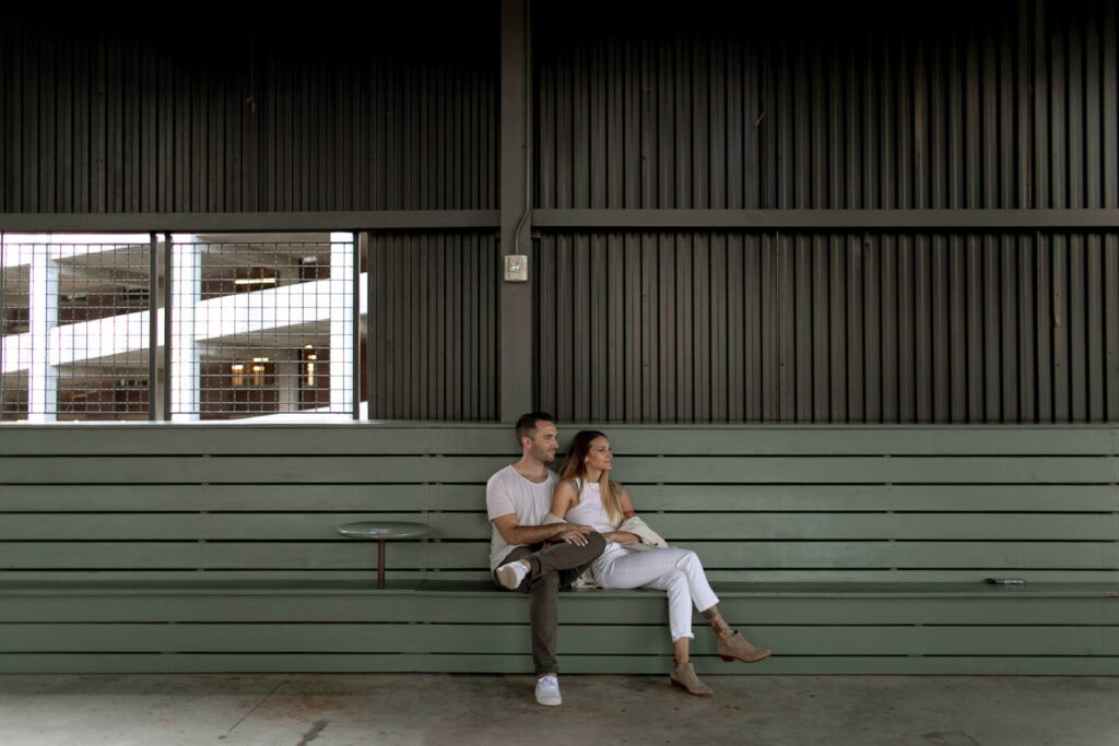 A couple sitting on a bench at The Roof at Ponce City Market in Atlanta.
