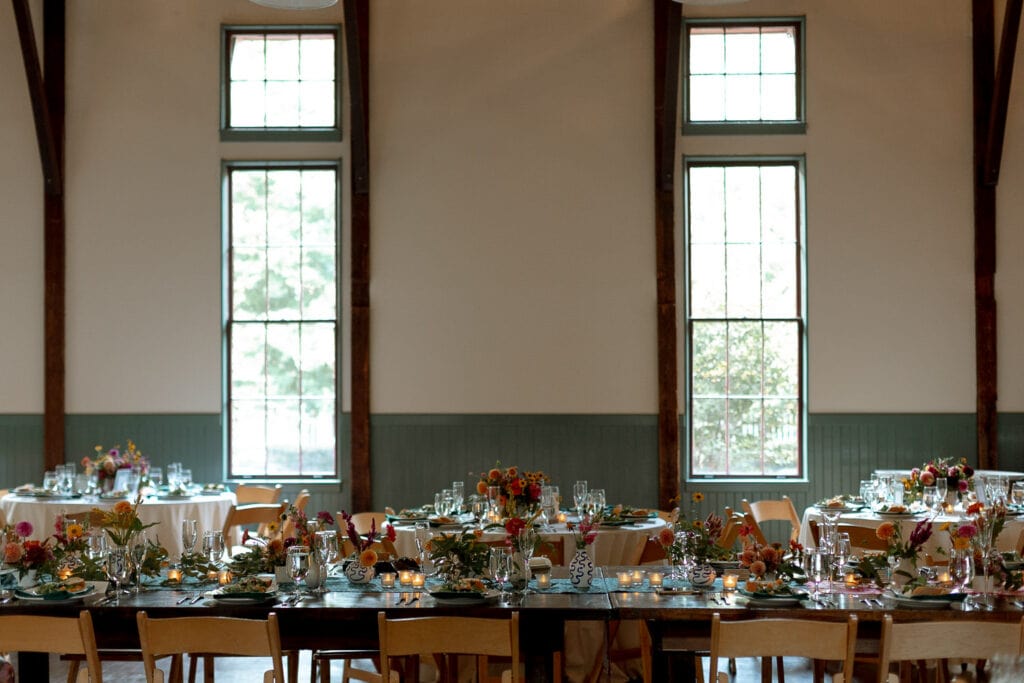 A tablescape at an indoor wedding reception at The Trolley Barn in Atlanta. 